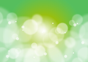 玉ボケがキラキラ光る背景イメージ（緑）