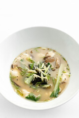 japanese miso soup with tofu, shiitake mushrooms, bok choy and seaweed