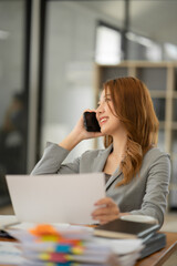 Asian businesswoman holding notebook about business, spending money