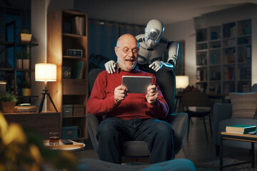 Senior man and humanoid robot watching videos together
