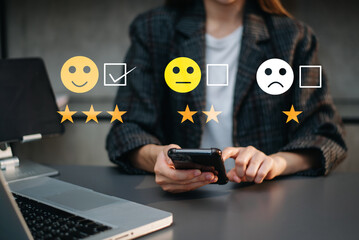 Customer service evaluation concept. Businesswoman pressing face smile emoticon show on virtual...