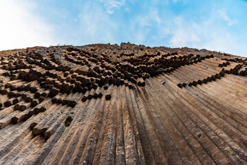 Symphony of Stones, Garni village. Armenia. Bottom-up view of the polygonal structure of basalt...