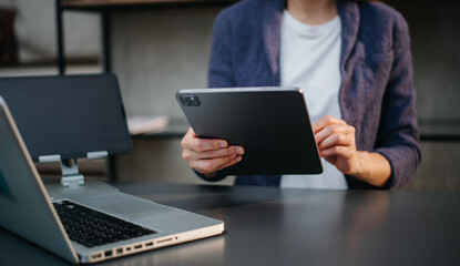 businesswoman hand working with new modern computer using on smartphone and tablet as concept..