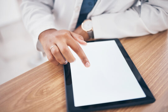 Mockup, typing and hand of doctor on a tablet for healthcare, email and online services. Research, medical and a pharmacist or medic worker scrolling on mock up space screen on tech for communication