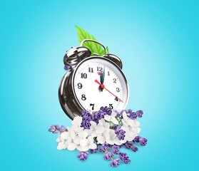 Spring background. Fresh beautiful spring flowers with clock