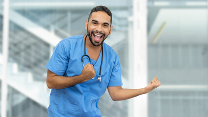 Cheering mexican male nurse or doctor with beard and stethoscope