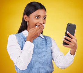 Wow, surprise and woman with phone in studio space reading text or email on yellow background....