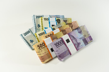 Jakarta, Indonesia, April 15, 2023, various bundles of Indonesian rupiah banknotes in the IDR currency thousands copy space thr zakat
