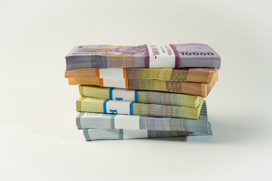 Jakarta, Indonesia, April 15, 2023, various bundles of Indonesian rupiah banknotes in the IDR currency thousands copy space thr zakat