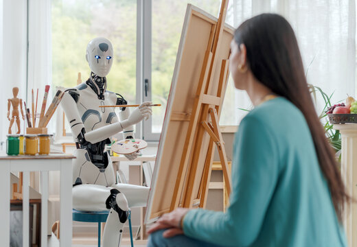 AI robot painting a portrait in the art studio