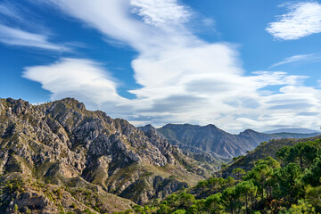 Fototapeta na wymiar Mountain landscape with dramatic clouds in the Sierras de Tejada, Province of Malaga, Andlusia, Spain