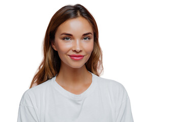 Fototapeta premium Pretty young woman uses cosmetics for looking young and beautiful, has long hair, looks confidently at camera with happy tender smile, wears casual outfit, poses over purple wall, blank space on right