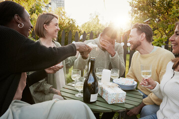 Happy friends having party in garden