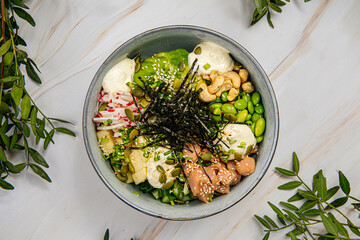 Portion of chicken poke bowl with cashew and vegetables