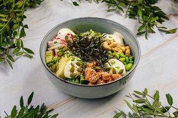 Portion of chicken poke bowl with cashew and vegetables