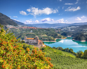 Fabulous  View of the Cles Castel, the Santa Giustina Lake and lots of apple plantations. - obrazy, fototapety, plakaty
