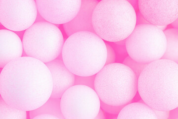Colorful balls background in pink colors. Background with balls in different sizes. Sphere of balls on pastel color..