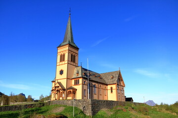 Fototapeta na wymiar Kabelvag Wooden Church in blue sky, Lofoten Islands, Norway