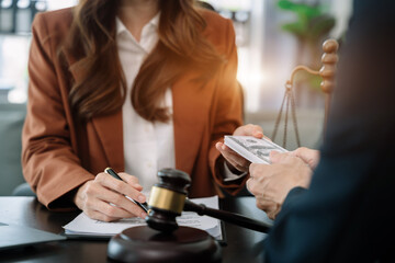 Businessman giving bribe money in the envelope to partner in a corruption scam in office.