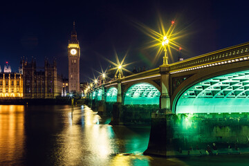 Obraz premium Night in London, Big Ben and Palace of Westminster over River Thames, London, England