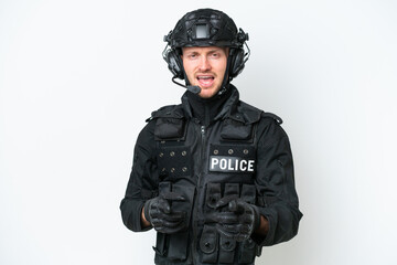 SWAT man over isolated white background pointing to the front and smiling