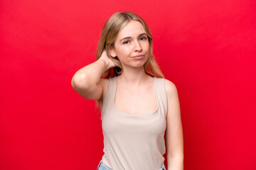 Young English woman isolated on red background having doubts