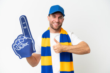 Young caucasian sports fan man isolated on white background giving a thumbs up gesture