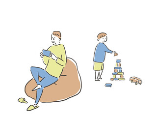 積み木とおもちゃで遊ぶ男の子とスマホを見ている男性、父親
