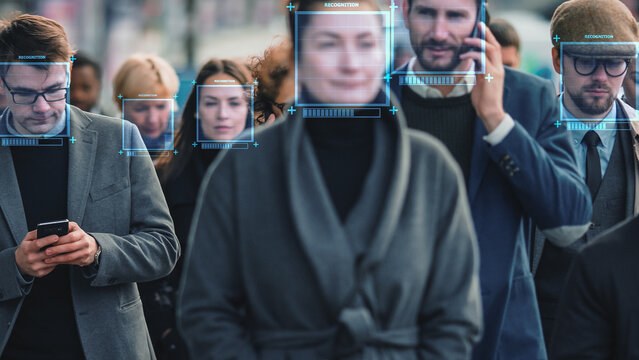 Crowd of Business People Tracked with Technology Walking on Busy Urban City Streets. CCTV AI Facial Recognition Big Data Analysis Interface Scanning, Showing Personal Information. Surveillance Concept