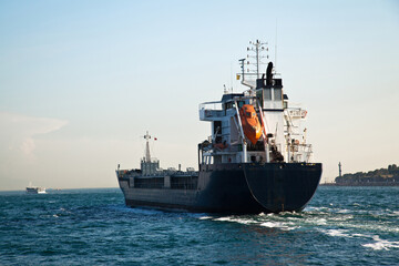 Large cargo ship engaged in international logistics transportation and passing through the Istanbul Bosphorus