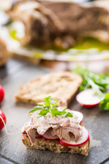 sandwich with baked meat, radish and herbs