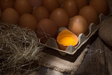 Freshly picked chicken eggs on a rustic background © Jan Kravа