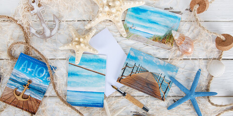 Türkis blaue Postkarten aus dem Urlaub schreiben: Dekoration Meer, maritim, Seesterne - 594962320