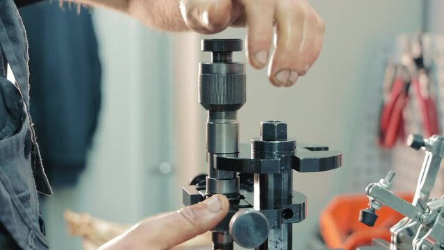 Repair of car injectors close-up. Disassembly of the nozzle and replacement of spare parts.