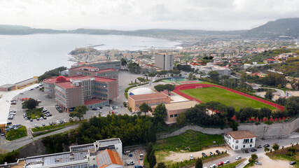 Aerial view of the Italian Air Force Academy in Pozzuoli, near Naples, Italy. It is a military school overlooking the Mediterranean Sea. - obrazy, fototapety, plakaty