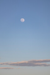 day moon with low clouds