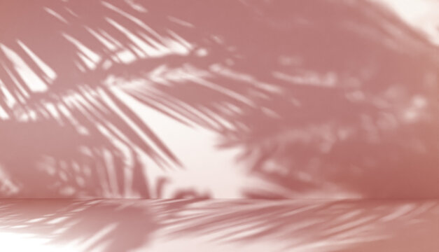 blurred shadow of palm leaves on a wall with red ligth. Abstract minimal background for a product presentation. Summer and spring seasons