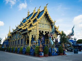 Blue god spirit Buddhist deity at Chiang Rai's Wat Rong Suea Ten (Blue Temple) - obrazy, fototapety, plakaty