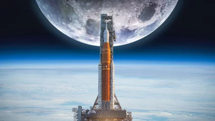 Fototapeten Spaceship on launch pad. Mission to Moon. Return on Moon. SLS space rocket. Orion spacecraft. Artemis space program to research solar system. Elements of this image furnished by NASA © dimazel