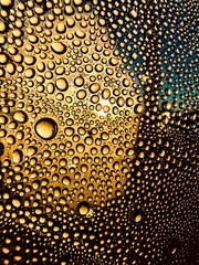 Closeup view of water droplets on a car window