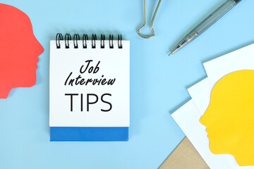 Job interview tips in human resources concept. Office flat lay of blue notepad with written text.