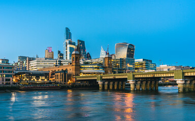 Fototapeta na wymiar Cannon Street Railway Bridge ane Skyscrapers over River Thames, London, England