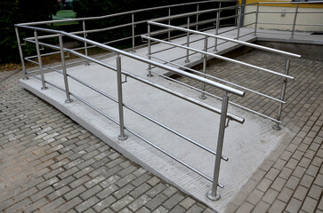 the curved ramp at the entrance to the building is suitable for wheelchair access and supply to the...