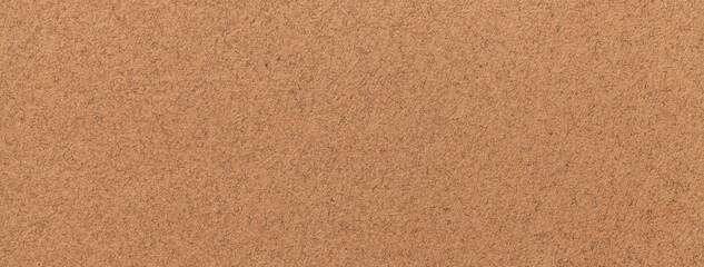 Texture of old brown color paper background, macro. Structure of a vintage craft beige cardboard.