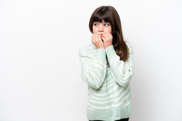 Little caucasian girl isolated on white background nervous and scared putting hands to mouth