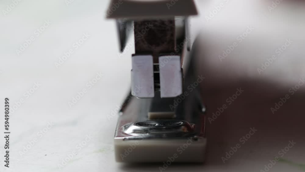 Poster stapler for paper staples sheets. side view