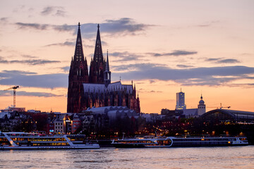 Sunset time. Cologne Dom and Rheine in Germany.
