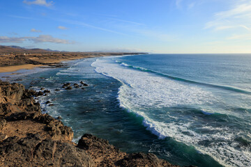 Waves rolling into Playa del Castillo El Cotillo Fuerteventura