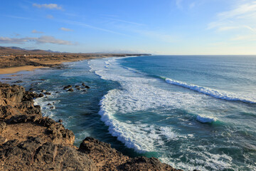 Waves rolling into Playa del Castillo El Cotillo Fuerteventura