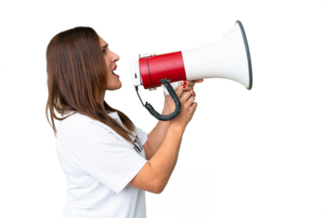 Middle age volunteer woman over isolated chroma key background shouting through a megaphone